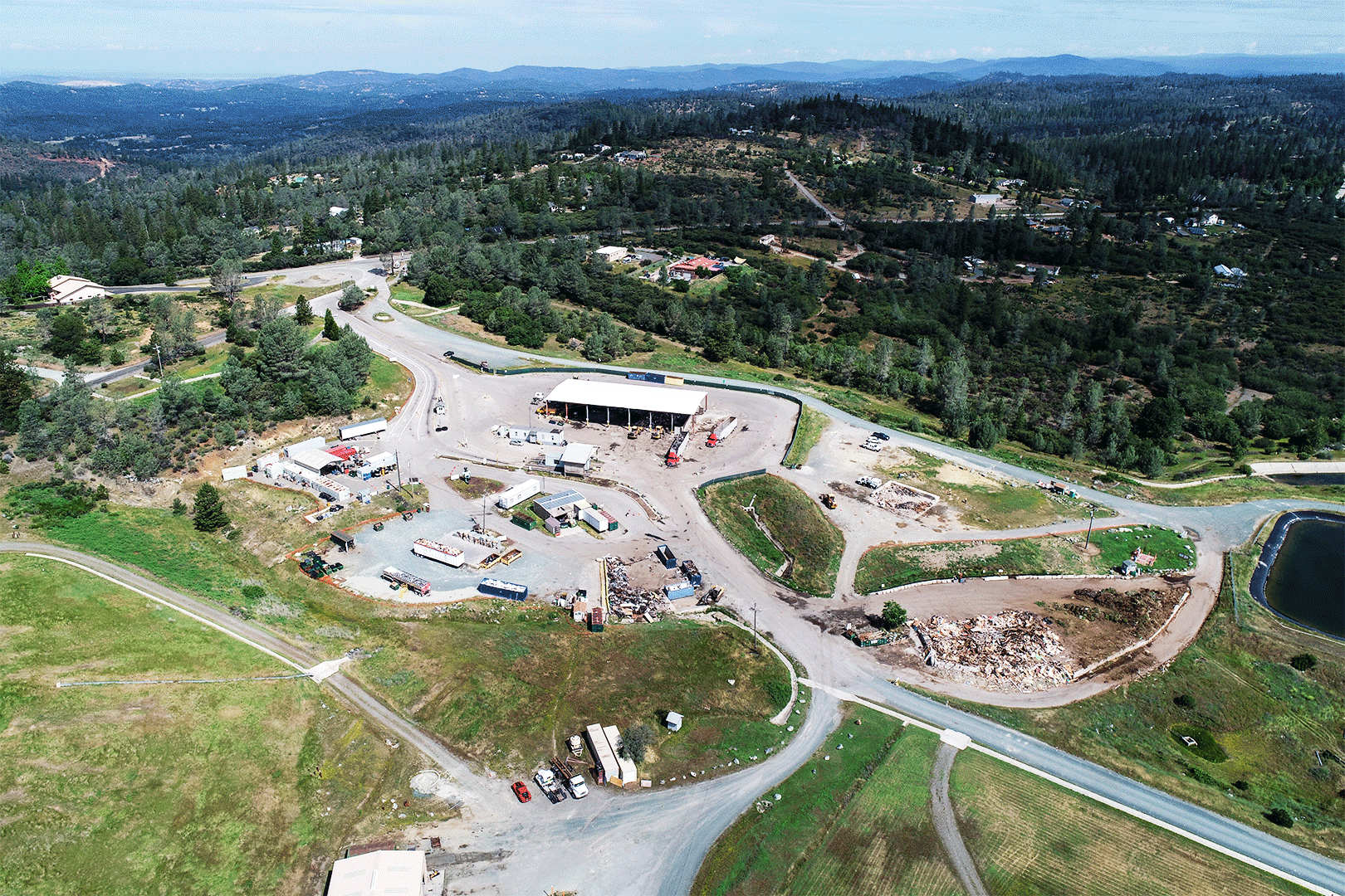 An aerial view shows the future overhead building and dock for trucks. From the building there is a road that wraps around the back to lead to the main road